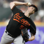 
              Baltimore Orioles starting pitcher Kyle Bradish delivers during the first inning of a baseball game against the Houston Astros, Friday, Aug. 26, 2022, in Houston. (AP Photo/Eric Christian Smith)
            