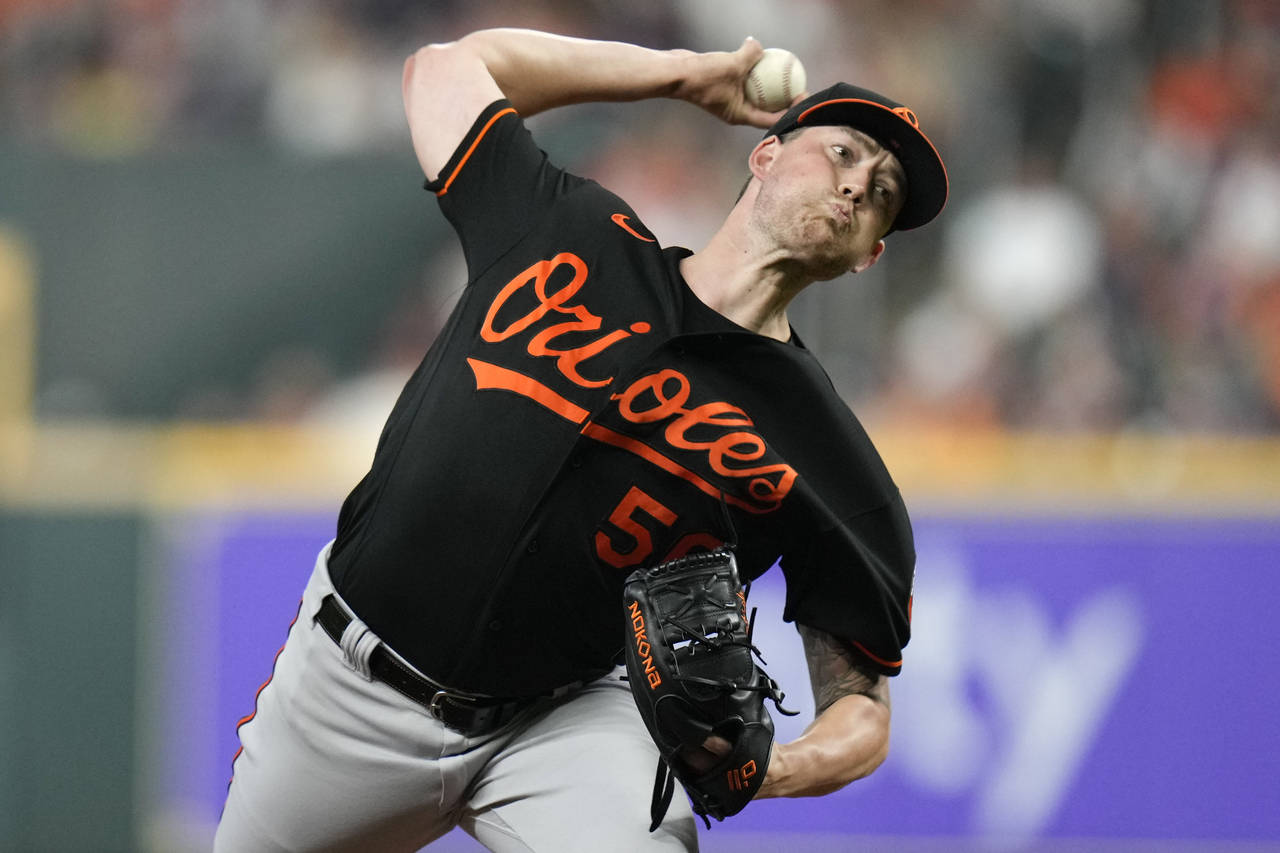 Baltimore Orioles starting pitcher Kyle Bradish delivers during the first inning of a baseball game...