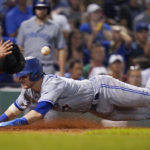 
              Toronto Blue Jays' Danny Jansen, right, beats the tag by Boston Red Sox catcher Reese McGuire to score on a single by Vladimir Guerrero Jr. during the fourth inning of a baseball game, Thursday, Aug. 25, 2022, in Boston. (AP Photo/Charles Krupa)
            