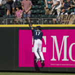 
              Seattle Mariners rightfielder Mitch Haniger cannot get to a homerun ball hit by Washington Nationals' Ildemaro Vargas during the ninth inning of a baseball game, Wednesday, Aug. 24, 2022, in Seattle. (AP Photo/Stephen Brashear)
            