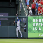 
              Chicago Cubs left fielder Ian Happ (8) catches a fly ball at the wall for the out on St. Louis Cardinals' Paul DeJong during the fourth inning of a baseball game Tuesday, Aug. 2, 2022, in St. Louis. (AP Photo / Scott Kane)
            