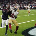 
              San Francisco 49ers cornerback Samuel Womack III (26) breaks up a pass intended for Houston Texans wide receiver Chris Moore (15) during the first half of an NFL football game Thursday, Aug. 25, 2022, in Houston. The ball was intercepted by San Francisco 49ers safety Tarvarius Moore (33). (AP Photo/David J. Phillip)
            