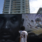 
              Artist Nikkolas Smith views a mural depicting Kobe Bryant and his daughter, Gianna, in Los Angeles, Wednesday, Aug. 24, 2022. The mural, painted by Odeith and Smith, was unveiled Wednesday to celebrate Kobe Bryant Day. (AP Photo/Jae C. Hong)
            