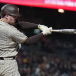 
              San Diego Padres' Brandon Drury hits an RBI single during the fifth inning of a baseball game against the San Francisco Giants in San Francisco, Monday, Aug. 29, 2022. (AP Photo/Jeff Chiu)
            