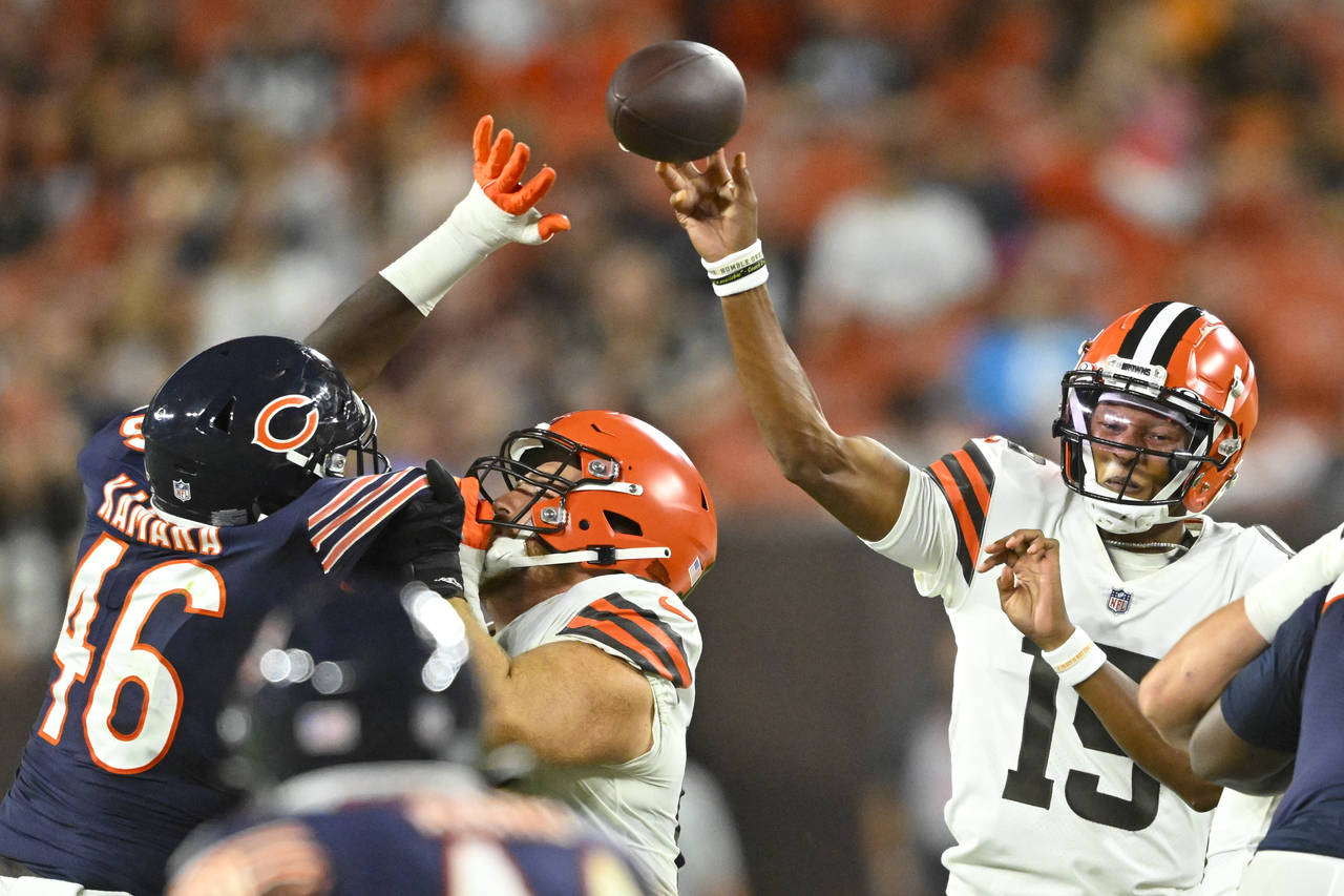 Cleveland Browns quarterback Joshua Dobbs (15) passes as Chicago Bears linebacker Sam Kamara (46) p...