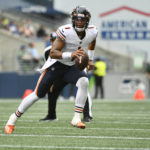 
              Chicago Bears quarterback Justin Fields looks to pass against the Seattle Seahawks during the first half of a preseason NFL football game, Thursday, Aug. 18, 2022, in Seattle. (AP Photo/Caean Couto)
            