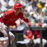 
              Los Angeles Angels designated hitter Shohei Ohtani grounds out against the Seattle Mariners during the first inning of a baseball game, Sunday, Aug. 7, 2022, in Seattle. (AP Photo/John Froschauer)
            