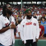 
              New England Patriots linebacker Matthew Judon, left, and cornerback Jalen Mills stand on the field before a baseball game between the Boston Red Sox and the New York Yankees, Saturday, Aug. 13, 2022, in Boston. (AP Photo/Michael Dwyer)
            