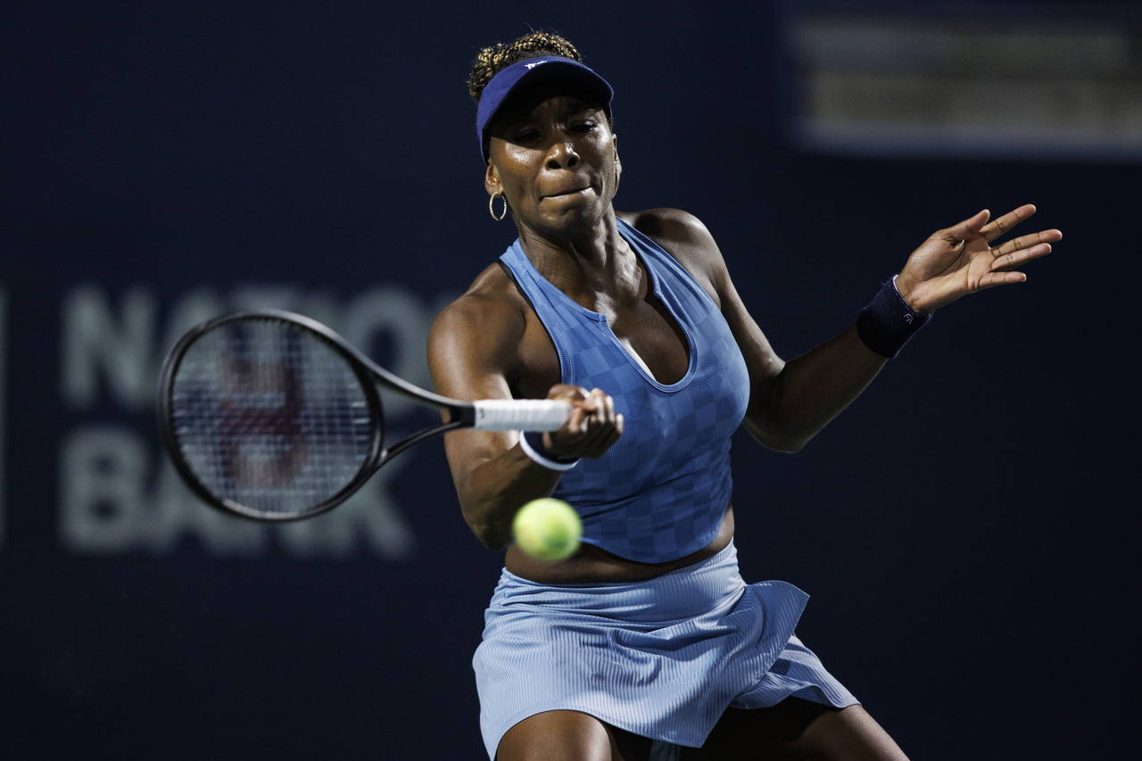 Venus Williams returns a ball from Jil Teichmann, of Switzerland, during women's tennis action at t...