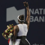 
              Serena Williams, of the United States, leaves the court while carrying flowers and waving to fans after her loss to Belinda Bencic, of Switzerland, during the National Bank Open tennis tournament Wednesday, Aug. 10, 2022, in Toronto. (Chris Young/The Canadian Press via AP)
            