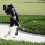 
              Adam Scott, of Australia, hist out of a bunker on the 18th hole during the second round of the BMW Championship golf tournament at Wilmington Country Club, Friday, Aug. 19, 2022, in Wilmington, Del. (AP Photo/Nick Wass)
            