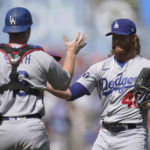 
              Los Angeles Dodgers catcher Will Smith, left, celebrates with pitcher Craig Kimbrel (46) after the Dodgers defeated the San Francisco Giants in a baseball game in San Francisco, Thursday, Aug. 4, 2022. (AP Photo/Jeff Chiu)
            
