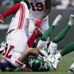 
              New York Jets cornerback Michael Carter II (30) is tackled by New York Giants guard Jon Feliciano (76) in the first half of a preseason NFL football game, Sunday, Aug. 28, 2022, in East Rutherford, N.J. (AP Photo/Julia Nikhinson)
            