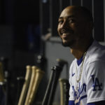 
              Los Angeles Dodgers right fielder Mookie Betts (50) smiles in the dugout during the fifth inning of a baseball game against the Milwaukee Brewers in Los Angeles, Tuesday, Aug. 23, 2022. (AP Photo/Ashley Landis)
            