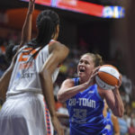 
              Chicago Sky forward Emma Meesseman (33) looks to the basket under pressure from Connecticut Sun forwards DeWanna Bonner (24) and Alyssa Thomas (obscured) during a WNBA basketball game in Uncasville, Conn., Sunday, July 31, 2022. (Sean D. Elliot/The Day via AP)
            