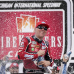 
              Kevin Harvick celebrates after winning the NASCAR Cup Series auto race at the Michigan International Speedway in Brooklyn, Mich., Sunday, Aug. 7, 2022. (AP Photo/Paul Sancya)
            