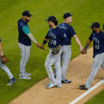 
              Seattle Mariners' Adam Frazier (26), Eugenio Suarez (28) and Carlos Santana (41) celebrate with teammates after a baseball game against the New York Yankees Tuesday, Aug. 2, 2022, in New York. The Mariners won 8-6. (AP Photo/Frank Franklin II)
            
