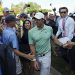 
              Rory McIlroy, of Northern Ireland, walks to the clubhouse after winning the final round of the Tour Championship golf tournament at East Lake Golf Club, Sunday, Aug. 28, 2022, in Atlanta. (AP Photo/John Bazemore)
            