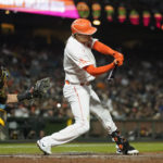 
              San Francisco Giants' Wilmer Flores hits a single against the San Diego Padres during the fifth inning of a baseball game in San Francisco, Tuesday, Aug. 30, 2022. (AP Photo/Godofredo A. Vásquez)
            