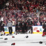 
              Canada celebrates the win over Finland during overtime of the world junior hockey championship gold medal game in Edmonton, Alberta, Saturday Aug. 20, 2022. (Jason Franson/The Canadian Press via AP)
            