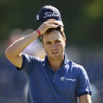 
              Justin Thomas wipes his head after he finished his round on the 18th green during the first round of the BMW Championship golf tournament at Wilmington Country Club, Thursday, Aug. 18, 2022, in Wilmington, Del. (AP Photo/Nick Wass)
            
