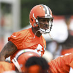 
              Cleveland Browns quarterback Deshaun Watson stretches during the NFL football team's training camp, Monday, Aug. 1, 2022, in Berea, Ohio. Watson was suspended for six games on Monday after being accused by two dozen women in Texas of sexual misconduct during massage treatments, in what a disciplinary officer said was behavior “more egregious than any before reviewed by the NFL.”  (AP Photo/Nick Cammett)
            