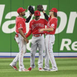 
              From left to right, Los Angeles Angels outfielders Jo Adell, Magneuris Sierra and Ryan Aguilar celebrate their victory over the Toronto Blue Jays in a baseball game in Toronto, Friday, Aug. 26, 2022. (Jon Blacker/The Canadian Press via AP)
            