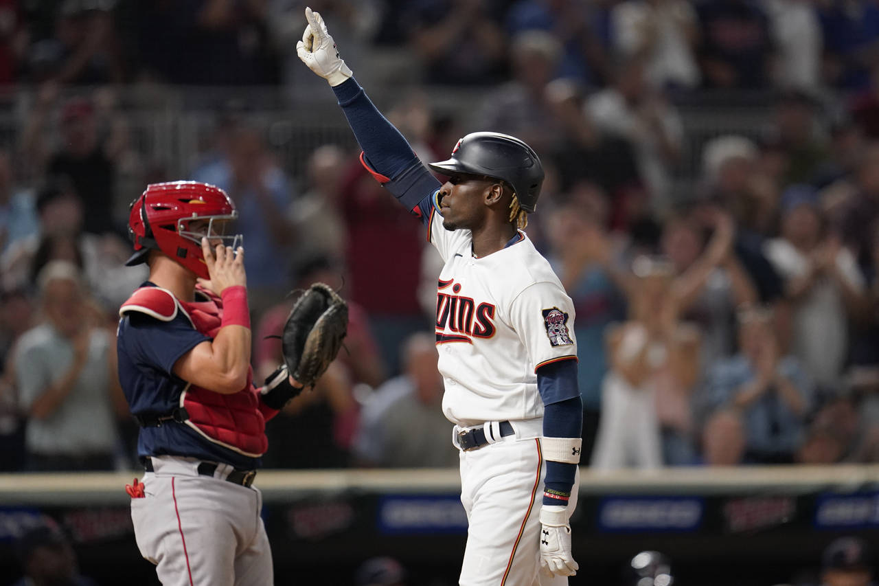 Minnesota Twins' Nick Gordon celebrates while crossing home plate after hitting a grand slam agains...