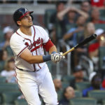 
              Atlanta Braves third baseman Austin Riley hits a two-RBI home run during the first inning of baseball game against the Colorado Rockies on Wednesday, Aug. 31, 2022, in Atlanta. (Curtis Compton/Atlanta Journal-Constitution via AP)
            