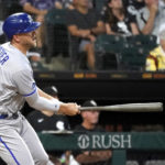 
              Kansas City Royals' Hunter Dozier watches his RBI double off Chicago White Sox starting pitcher Lucas Giolito, scoring MJ Melendez, during the third inning of a baseball game Tuesday, Aug. 2, 2022, in Chicago. (AP Photo/Charles Rex Arbogast)
            
