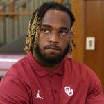 
              FILE - Oklahoma's Eric Gray speaks during an NCAA college football media day, Tuesday, Aug. 2, 2022, in Norman, Okla. (AP Photo/Sue Ogrocki, File)
            