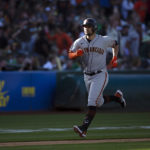 
              San Francisco Giants' J.D. Davis heads home with a solo home run against the Oakland Athletics during the sixth inning of a baseball game Saturday, Aug. 6, 2022, in Oakland, Calif. (AP Photo/D. Ross Cameron)
            