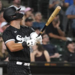 
              Chicago White Sox's Gavin Sheets watches his sacrifice fly off Kansas City Royals relief pitcher Dylan Coleman, scoring Leury Garcia, during the seventh inning of a baseball game Monday, Aug. 1, 2022, in Chicago. (AP Photo/Charles Rex Arbogast)
            