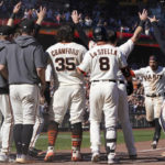 
              San Francisco Giants' Thairo Estrada, second from right, celebrates with teammates after hitting a two-run home run against the Pittsburgh Pirates during the ninth inning of a baseball game in San Francisco, Sunday, Aug. 14, 2022. (AP Photo/Jeff Chiu)
            