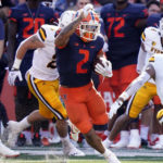 
              Illinois running back Chase Brown (2) carries the ball during the first half of an NCAA college football game against Wyoming, Saturday, Aug. 27, 2022, in Champaign, Ill. (AP Photo/Charles Rex Arbogast)
            