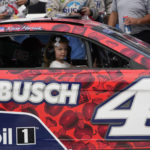 
              Kevin Harvick's daughter Piper rides in his car after winning the NASCAR Cup Series auto race at the Michigan International Speedway in Brooklyn, Mich., Sunday, Aug. 7, 2022. (AP Photo/Paul Sancya)
            