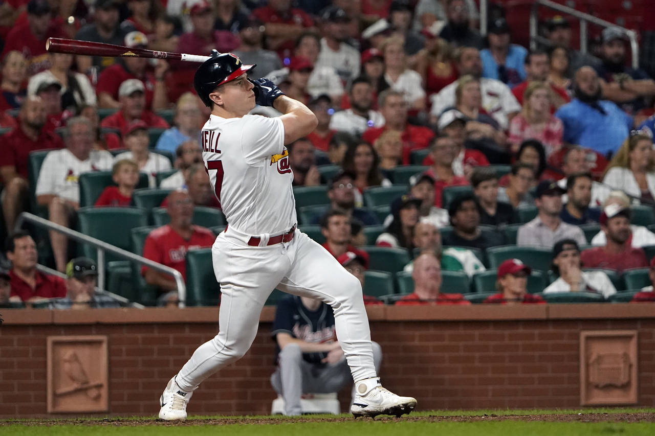 St. Louis Cardinals' Tyler O'Neill watches his three-run home run during the eighth inning of a bas...