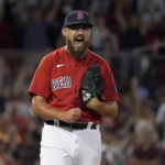 
              Boston Red Sox relief pitcher John Schreiber reacts after getting the final out against the Baltimore Orioles in a baseball game at Fenway Park, Thursday, Aug. 11, 2022, in Boston. (AP Photo/Mary Schwalm)
            