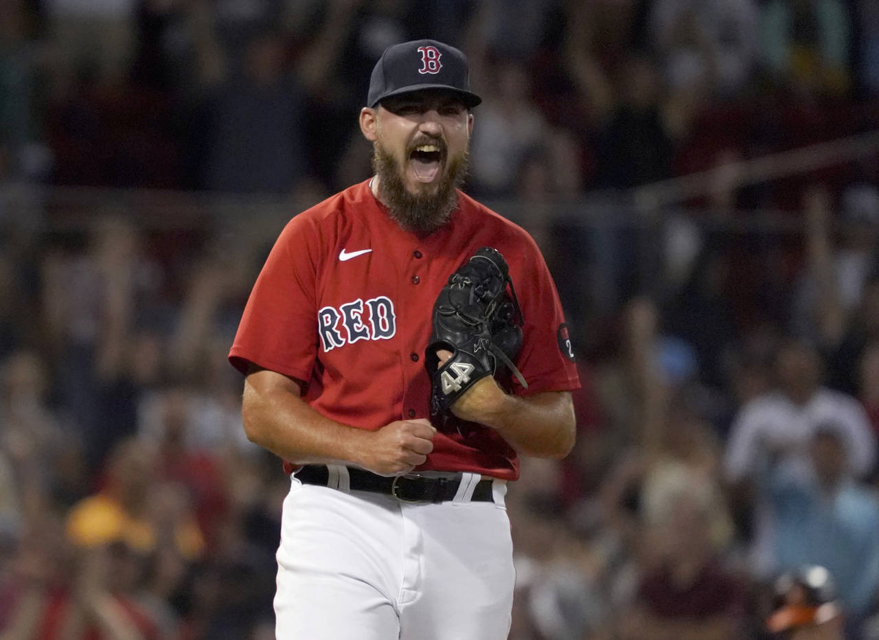 Boston Red Sox relief pitcher John Schreiber reacts after getting the final out against the Baltimo...