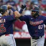 
              Minnesota Twins' Gilberto Celestino (67) celebrates with Gio Urshela (15) after hitting a home run during the second inning of a baseball game in Anaheim, Calif., Friday, Aug. 12, 2022. Urshela also scored. (AP Photo/Ashley Landis)
            