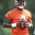 
              Cleveland Browns quarterback Deshaun Watson takes part in drills during the NFL football team's training camp, Monday, Aug. 1, 2022, in Berea, Ohio. (AP Photo/Nick Cammett)
            