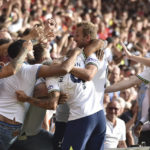 
              Tottenham's Harry Kane, centre, celebrates scoring his side's second goal during the English Premier League soccer match between Nottingham Forest and Tottenham Hotspur at the City Ground stadium in Nottingham, England, Sunday, Aug. 28, 2022.(AP Photo/Rui Vieira)
            