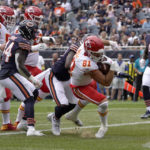 
              Kansas City Chiefs tight end Blake Bell scores during the first half of an NFL preseason football game against the Chicago Bears Saturday, Aug. 13, 2022, in Chicago. (AP Photo/David Banks)
            