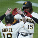 
              Pittsburgh Pirates' Oneil Cruz, right, celebrates with Ben Gamel (18) after driving him in with a two-run home run against the Milwaukee Brewers during the seventh inning of a baseball game Wednesday, Aug. 3, 2022, in Pittsburgh. (AP Photo/Keith Srakocic)
            