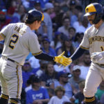 
              Milwaukee Brewers' Keston Hiura, right, celebrates with Luis Urias after hitting a solo home run during the seventh inning of a baseball game against the Chicago Cubs in Chicago, Sunday, Aug. 21, 2022. (AP Photo/Nam Y. Huh)
            