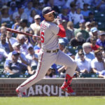 
              Washington Nationals' Joey Meneses watches his single off Chicago Cubs starting pitcher Justin Steele during the fourth inning of a baseball game Wednesday, Aug. 10, 2022, in Chicago. (AP Photo/Charles Rex Arbogast)
            