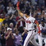 
              Atlanta Braves' Vaughn Grissom celebrates while running the bases on his two-run home run against the Boston Red Sox during the seventh inning of a baseball game Wednesday, Aug. 10, 2022, in Boston. At right is Braves third base coach Ron Washington. (AP Photo/Charles Krupa)
            