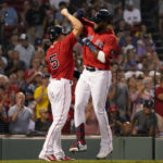 
              Boston Red Sox's Franchy Cordero, right, is congratulated by teammate Enrique Hernandez (5) after both scored on a two-run home run by Cordero during the second inning of a baseball game against the Toronto Blue Jays at Fenway Park, Wednesday, Aug. 24, 2022, in Boston. (AP Photo/Mary Schwalm)
            