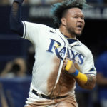 
              Tampa Bay Rays' Harold Ramirez reacts after scoring on a two-run single by Randy Arozarena off Kansas City Royals starting pitcher Brady Singer during the sixth inning of a baseball game Friday, Aug. 19, 2022, in St. Petersburg, Fla. (AP Photo/Chris O'Meara)
            