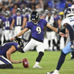 
              Baltimore Ravens place kicker Justin Tucker (9), with Jordan Stout holding, kicks a field goal against the Tennessee Titans during the second half of a preseason NFL football game, Thursday, Aug. 11, 2022, in Baltimore. (AP Photo/Gail Burton)
            